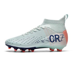 Junior football boots firm ground - side view with durable studs for youth players
