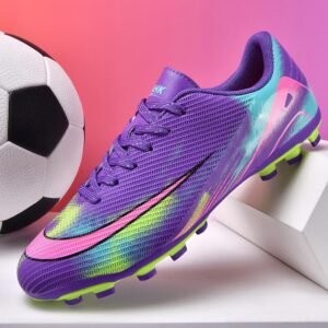 Multi-ground outsole on durable youth soccer cleats for versatile traction