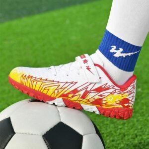 Kid wearing extra cushion soccer cleats on hard artificial turf field