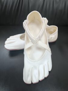 Five toe dance shoes with individual toe pockets and a flexible pivot sole
